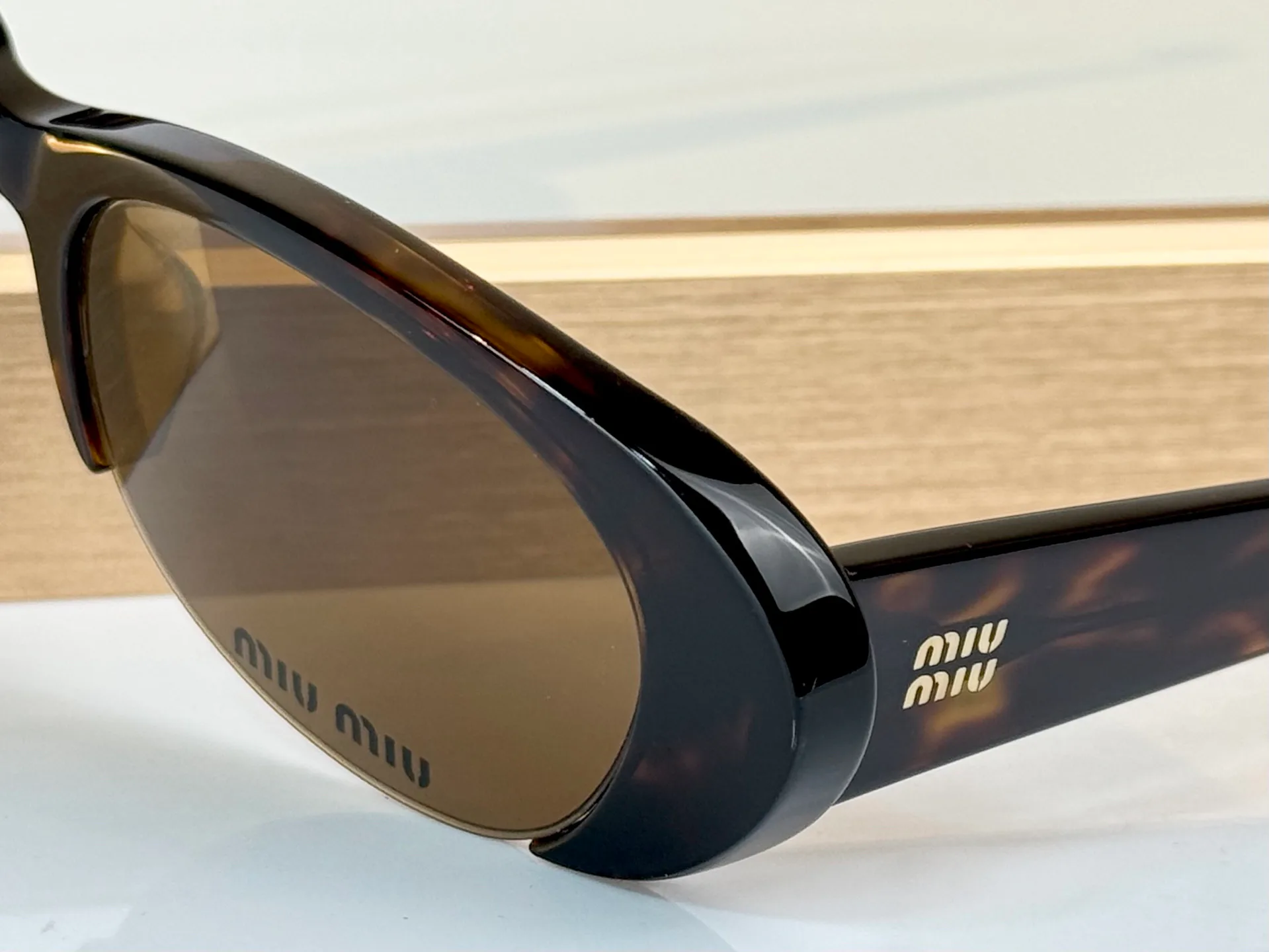 Glasses MIU MIU 18059896